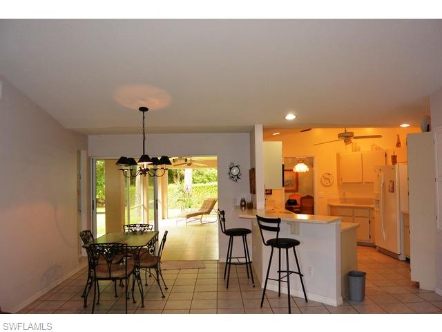899 Coldstream Court Naples, FL 34104 - Photo 10 of 19 KITCHEN AND INFORMAL DINING