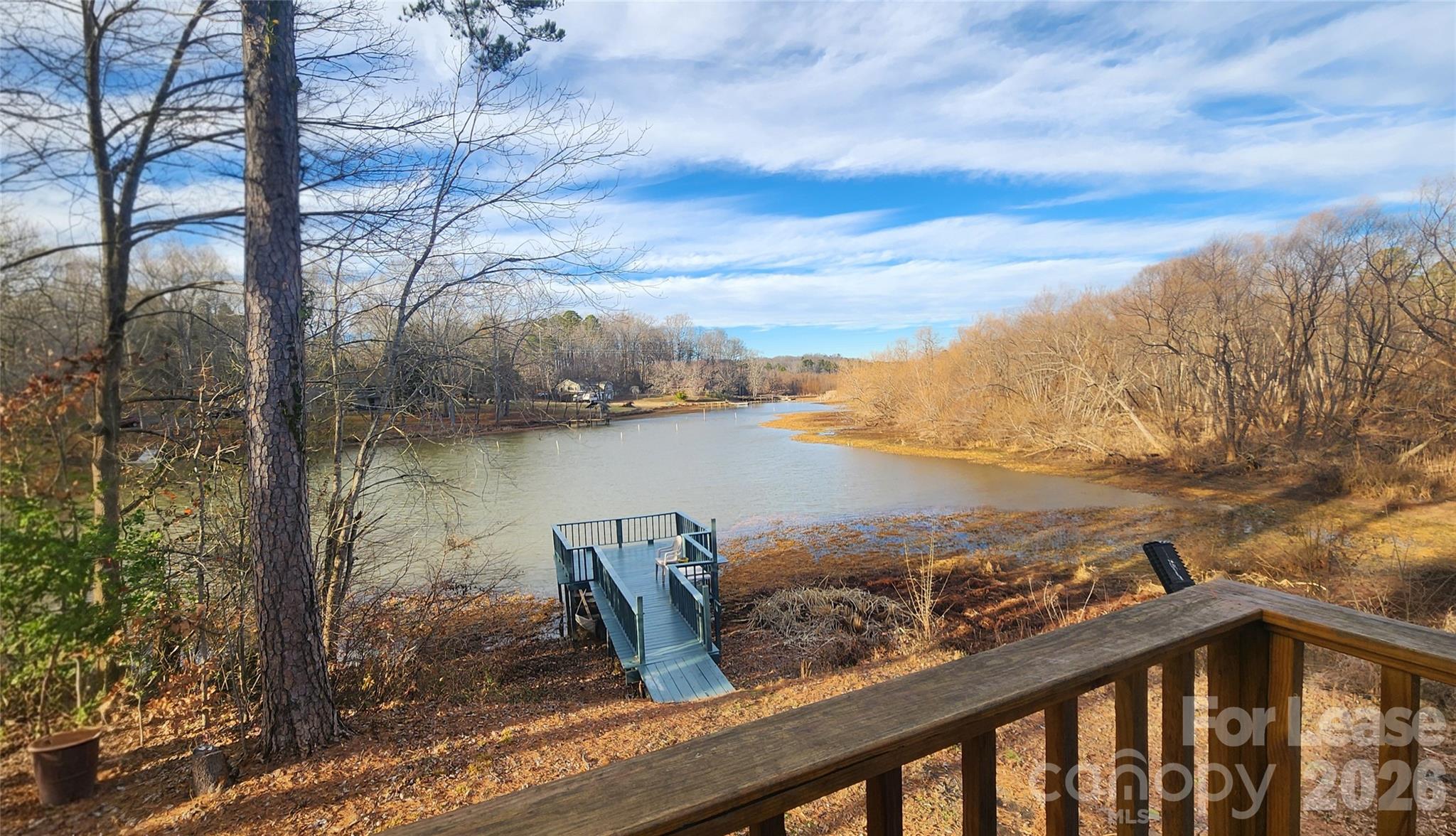118 Fisherman Cove Road Belmont, NC 28012 - Photo 3 of 12 a view of a lake from a yard