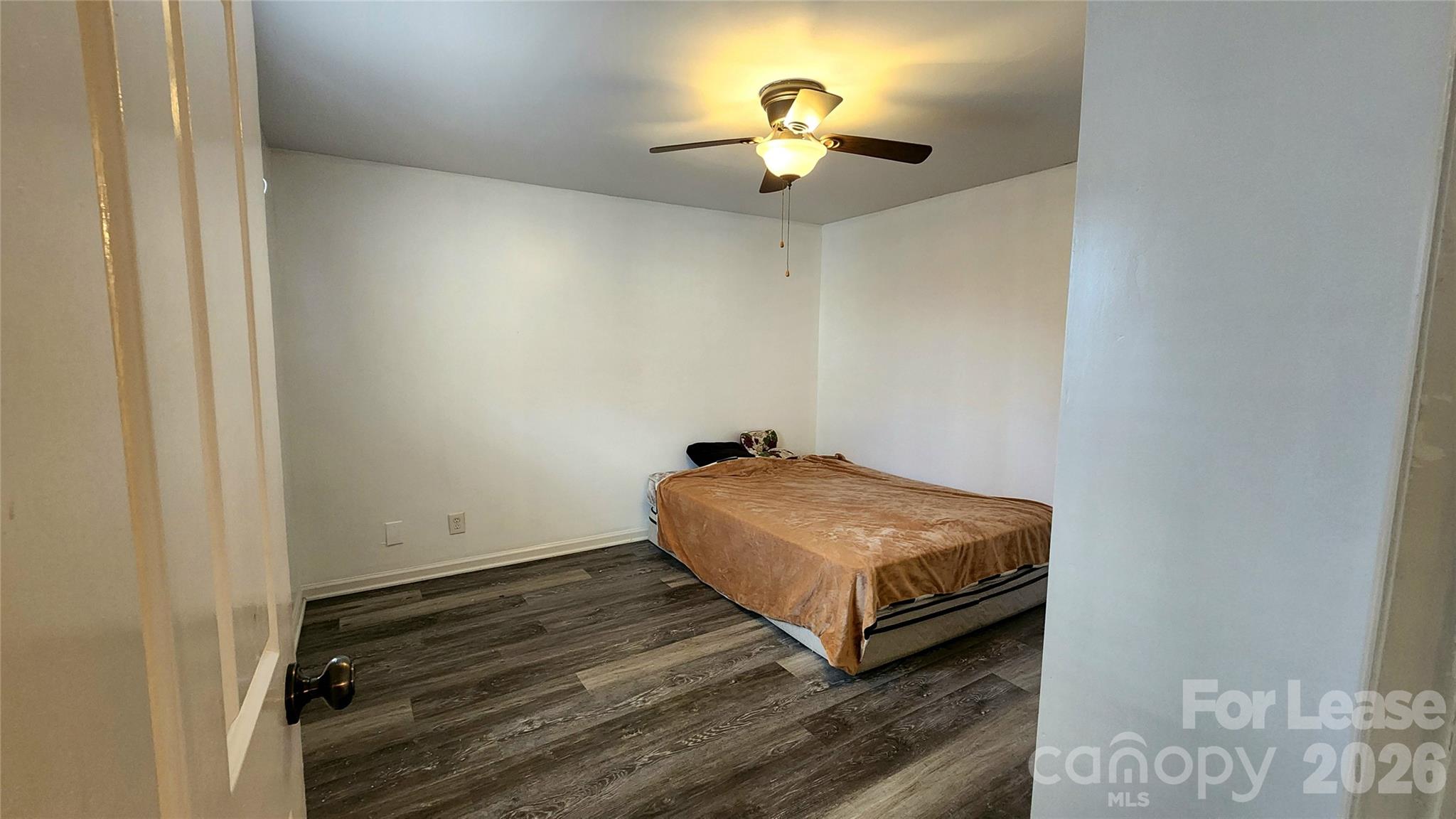 118 Fisherman Cove Road Belmont, NC 28012 - Photo 9 of 12 a bedroom with a bed and a chandelier