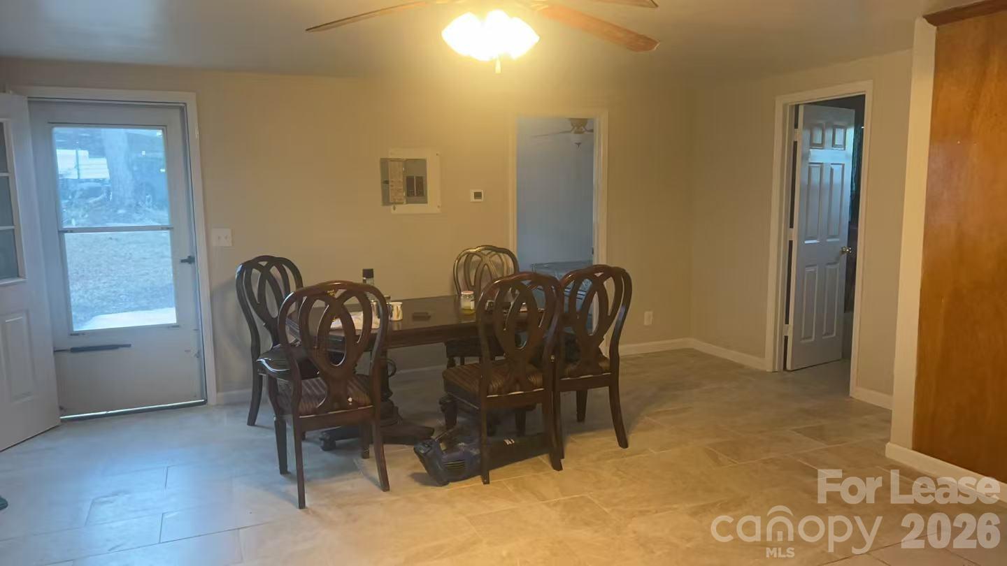 118 Fisherman Cove Road Belmont, NC 28012 - Photo 10 of 12 a view of a dining room with furniture and window