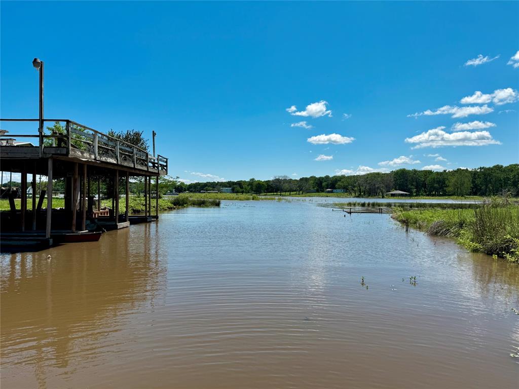 706 Sandpiper Circle Seven Points, TX 75143 - Photo 11 of 22 a view of a lake with houses in the background