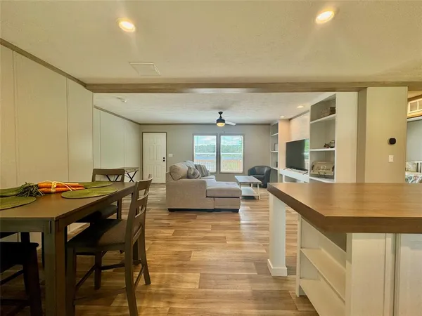a living room with furniture window and flat screen tv