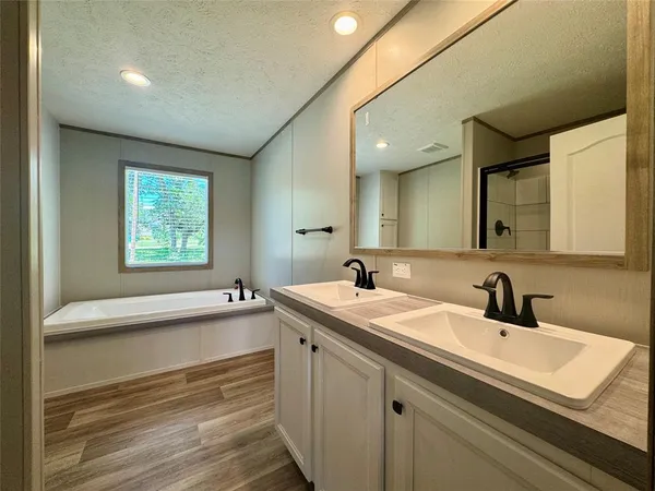 a bathroom with a glass shower door