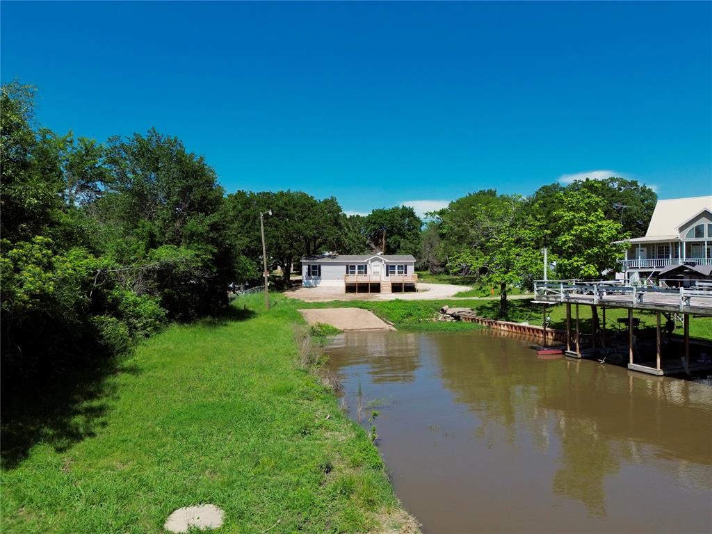 706 Sandpiper Circle Seven Points, TX 75143 - Photo 9 of 22 a view of residential house with outdoor space and lake view