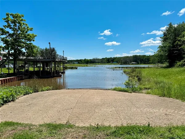 a view of a lake with houses in the background