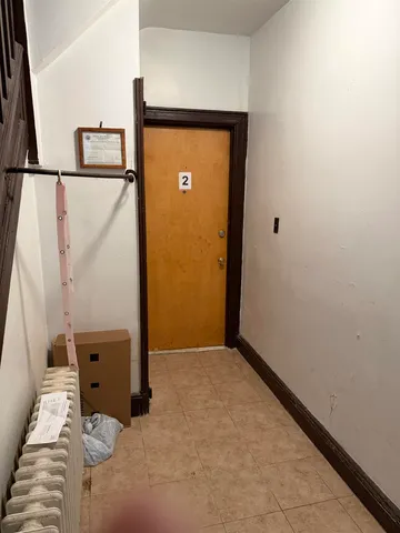 a view of walk in closet with empty room