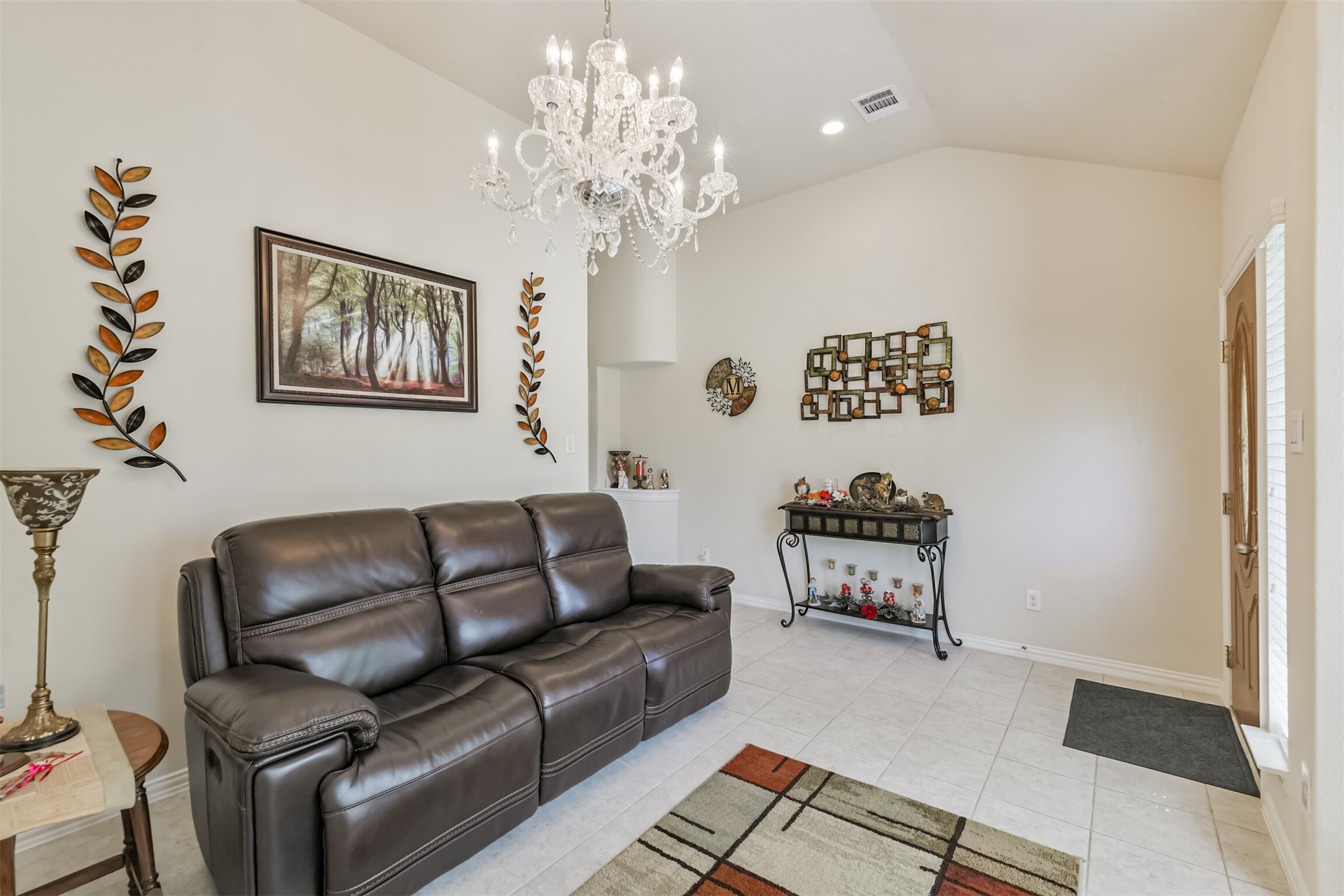 7527 Windsor Valley Lane Houston, TX 77049 - Photo 8 of 35 a living room with furniture and a chandelier