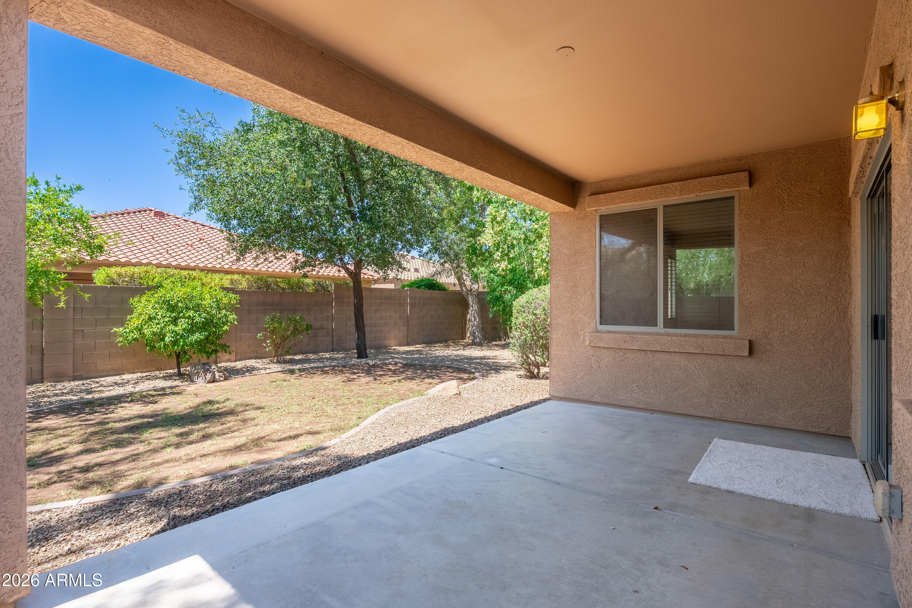 4317 East Folgers Road Phoenix, AZ 85050 - Photo 25 of 40 a view of a house with a yard and potted plants