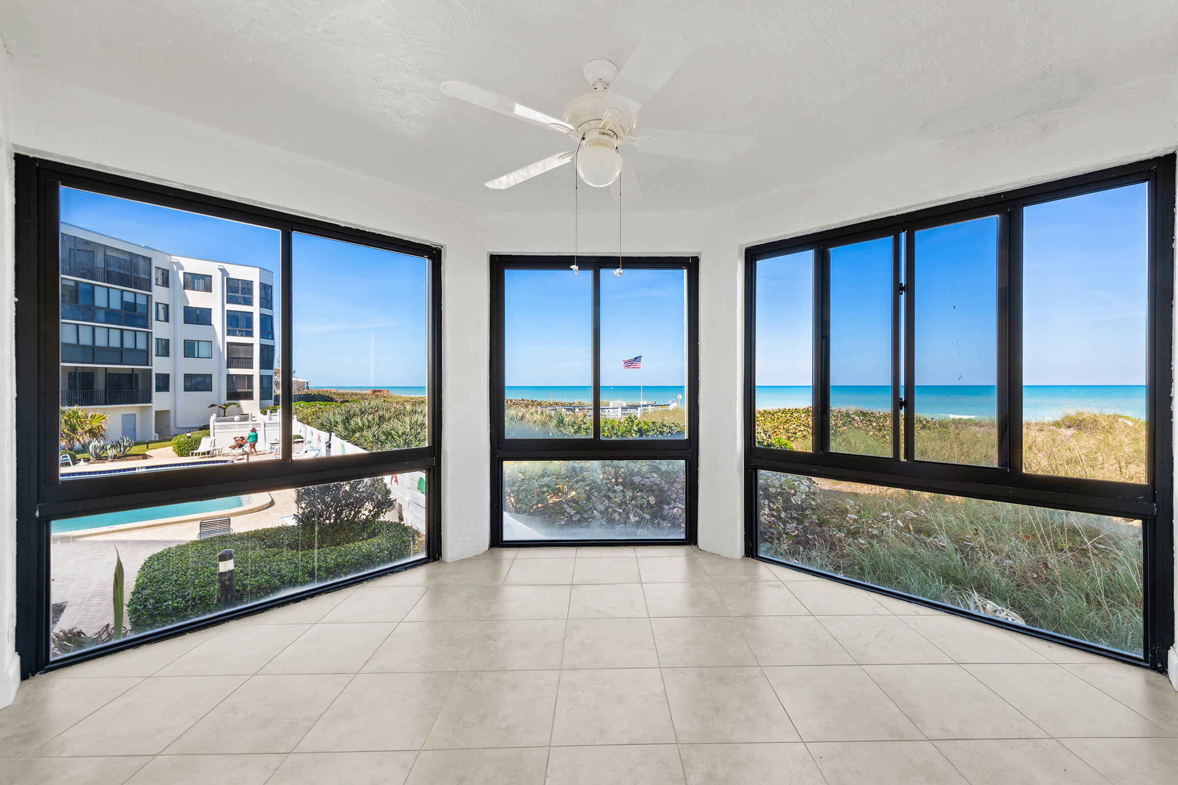 2375 Northeast Ocean Boulevard, Unit E103 Stuart, FL 34996 - Photo 1 of 49 a view of lobby with a floor to ceiling window and a floor to ceiling window
