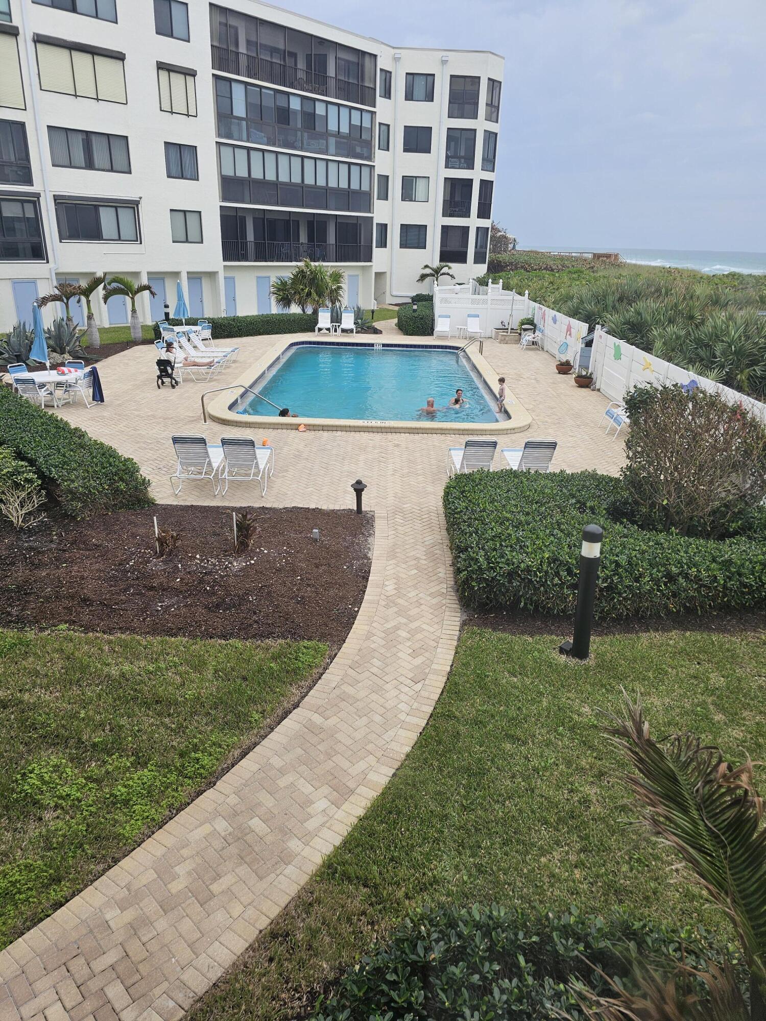 2375 Northeast Ocean Boulevard, Unit E103 Stuart, FL 34996 - Photo 2 of 49 a view of a swimming pool with a patio