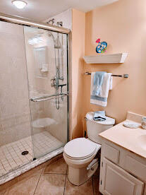 2375 Northeast Ocean Boulevard, Unit E103 Stuart, FL 34996 - Photo 30 of 49 a bathroom with a shower a toilet and a shower