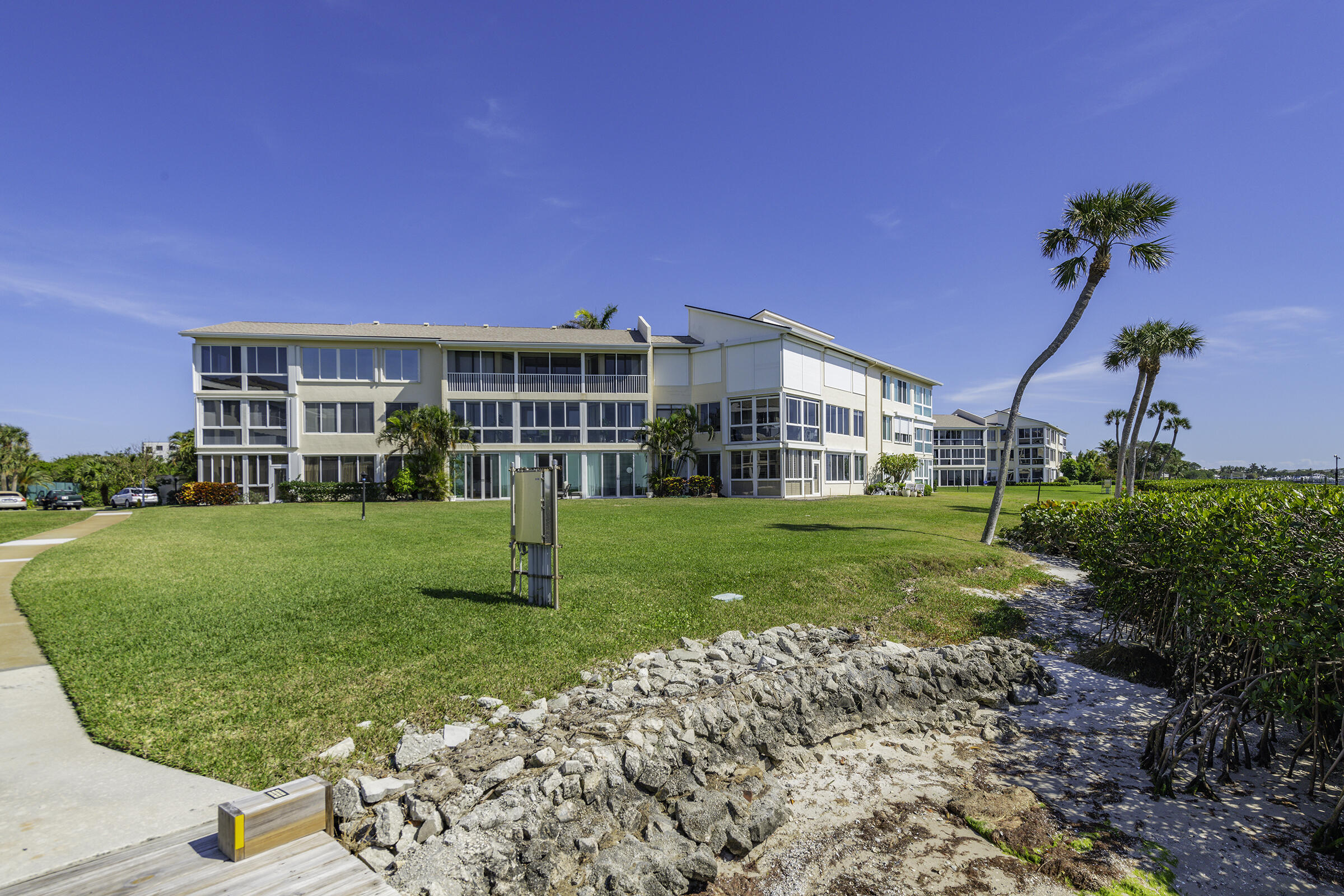 2375 Northeast Ocean Boulevard, Unit E103 Stuart, FL 34996 - Photo 49 of 49 a view of a house with a big yard