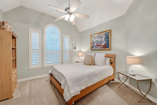 a living room with furniture a chandelier and a window