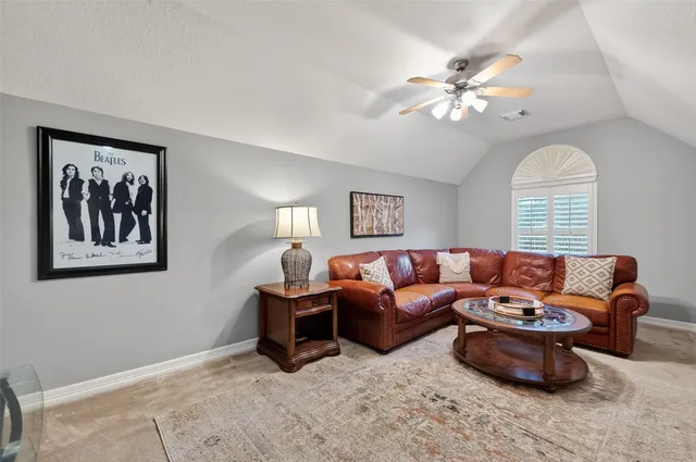 a spacious bedroom with a bed and furniture