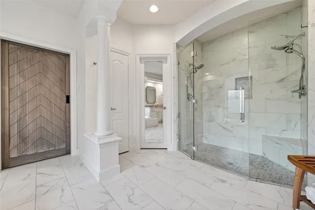 a bathroom with a sink a toilet and mirror