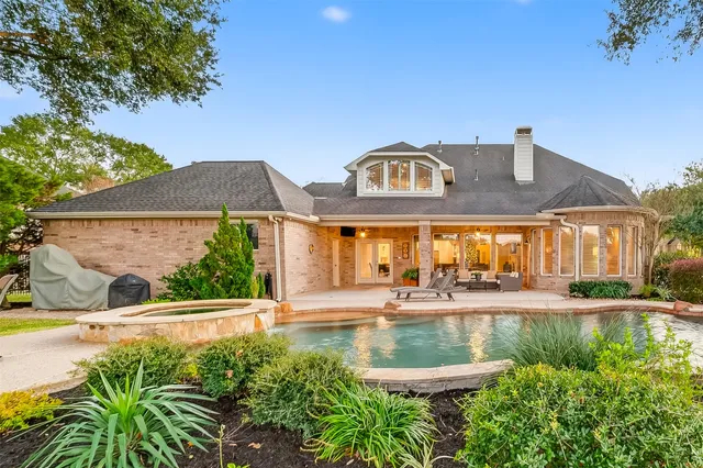 a view of a patio with table and chairs and potted plants