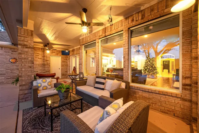 a view of a house with swimming pool and sitting area