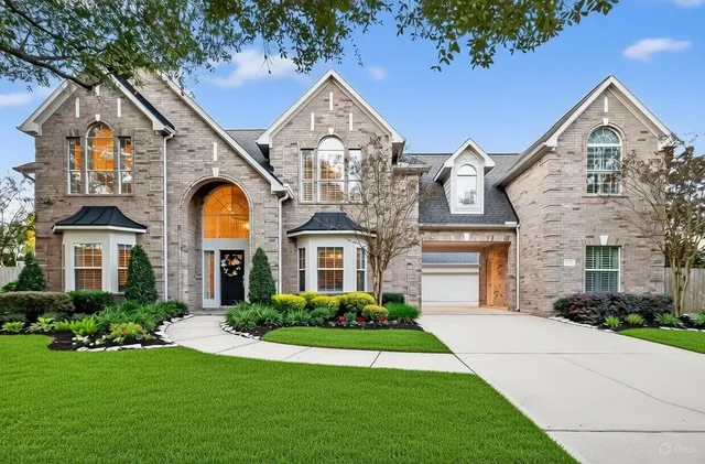 a view of house with a swimming pool
