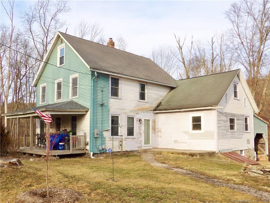 148 North Road Windham, CT 06280 - Photo 1 of 1 a view of a house with a patio and a yard