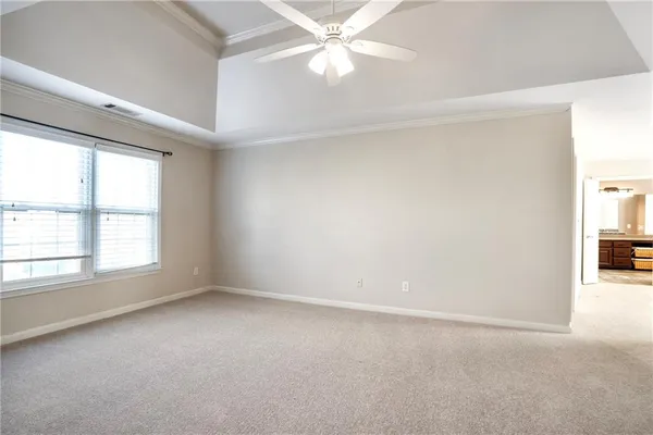 a view of a room cabinet and windows