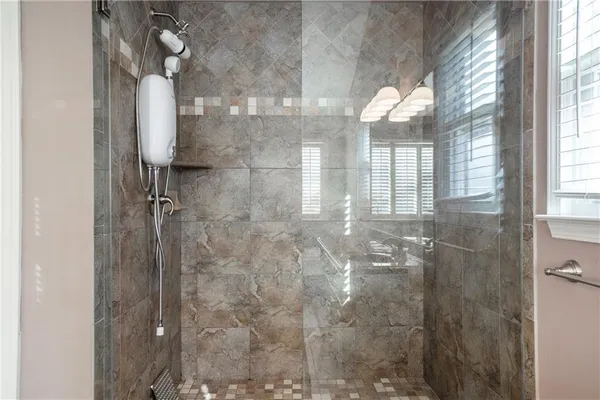 a bathroom with a sink double vanity and a mirror