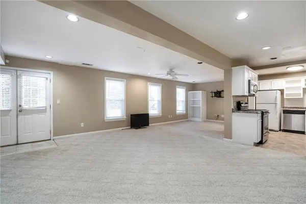 a kitchen with a refrigerator and a sink