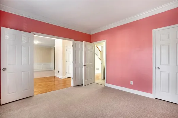 an empty room with a empty space and windows