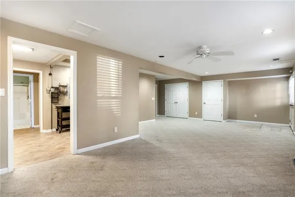 a kitchen with stainless steel appliances granite countertop a stove a refrigerator and a sink