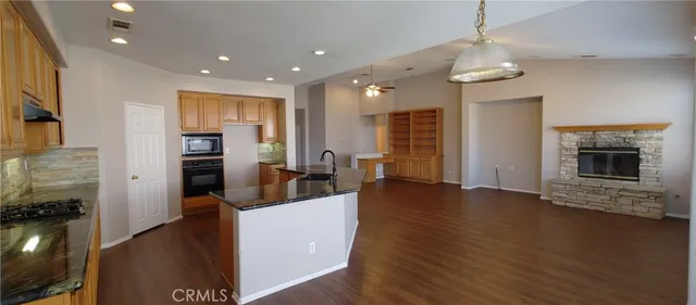 a kitchen with a sink and large window