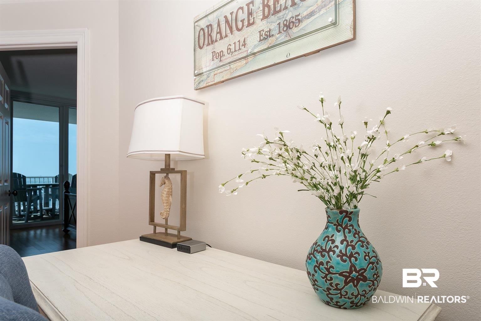27800 Canal Road, Unit 411 Orange Beach, AL 36561 - Photo 27 of 49 Light-colored desk surface with a crisp white wall backdrop