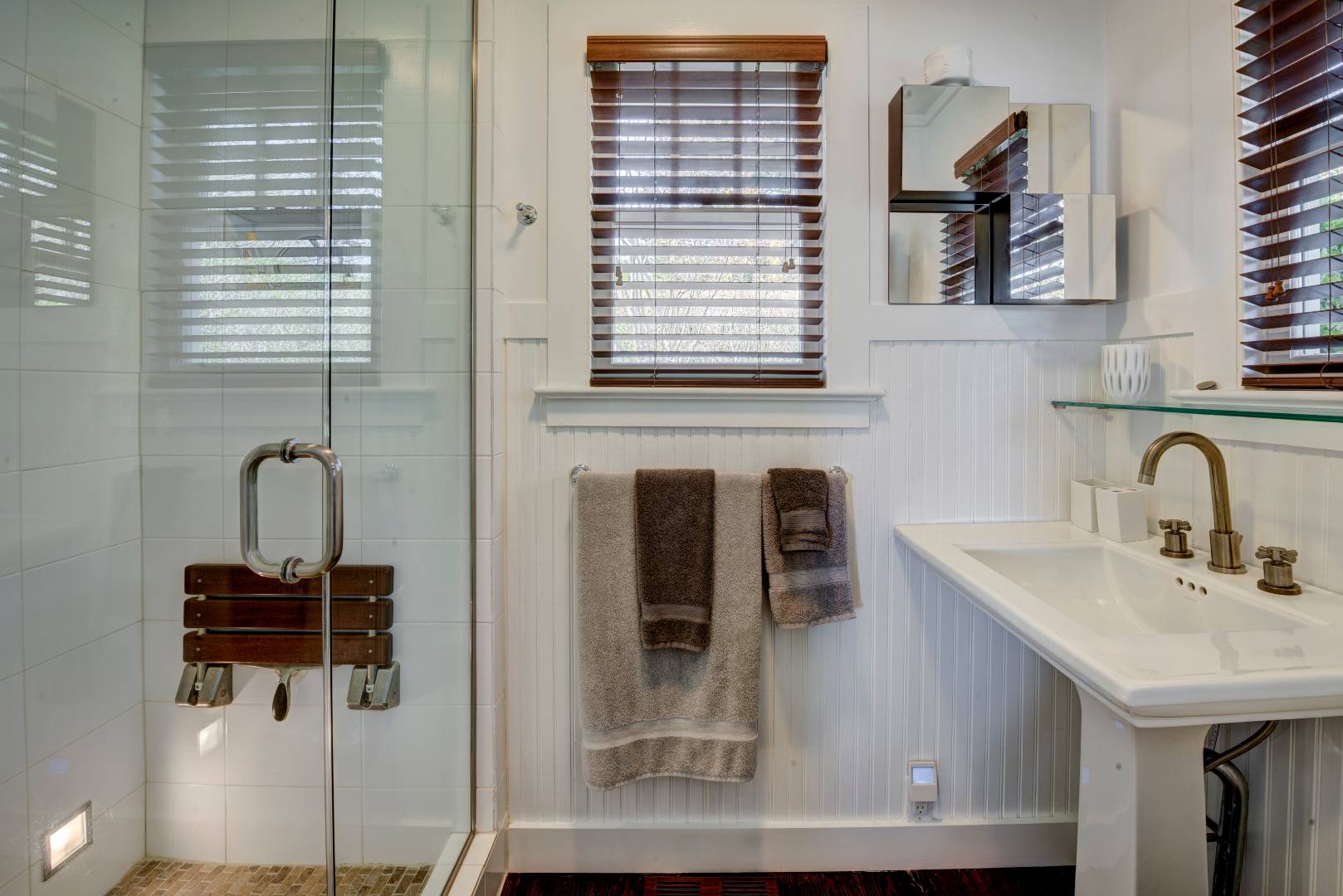 Undisclosed Address Sag Harbor, NY 11963 - Photo 13 of 16 a bathroom with a sink and a mirror