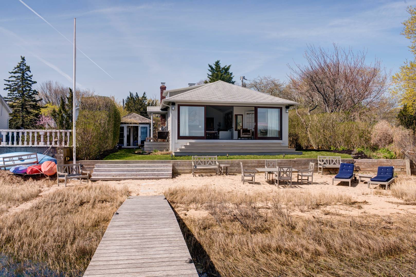 Undisclosed Address Sag Harbor, NY 11963 - Photo 14 of 16 a front view of a house with garden