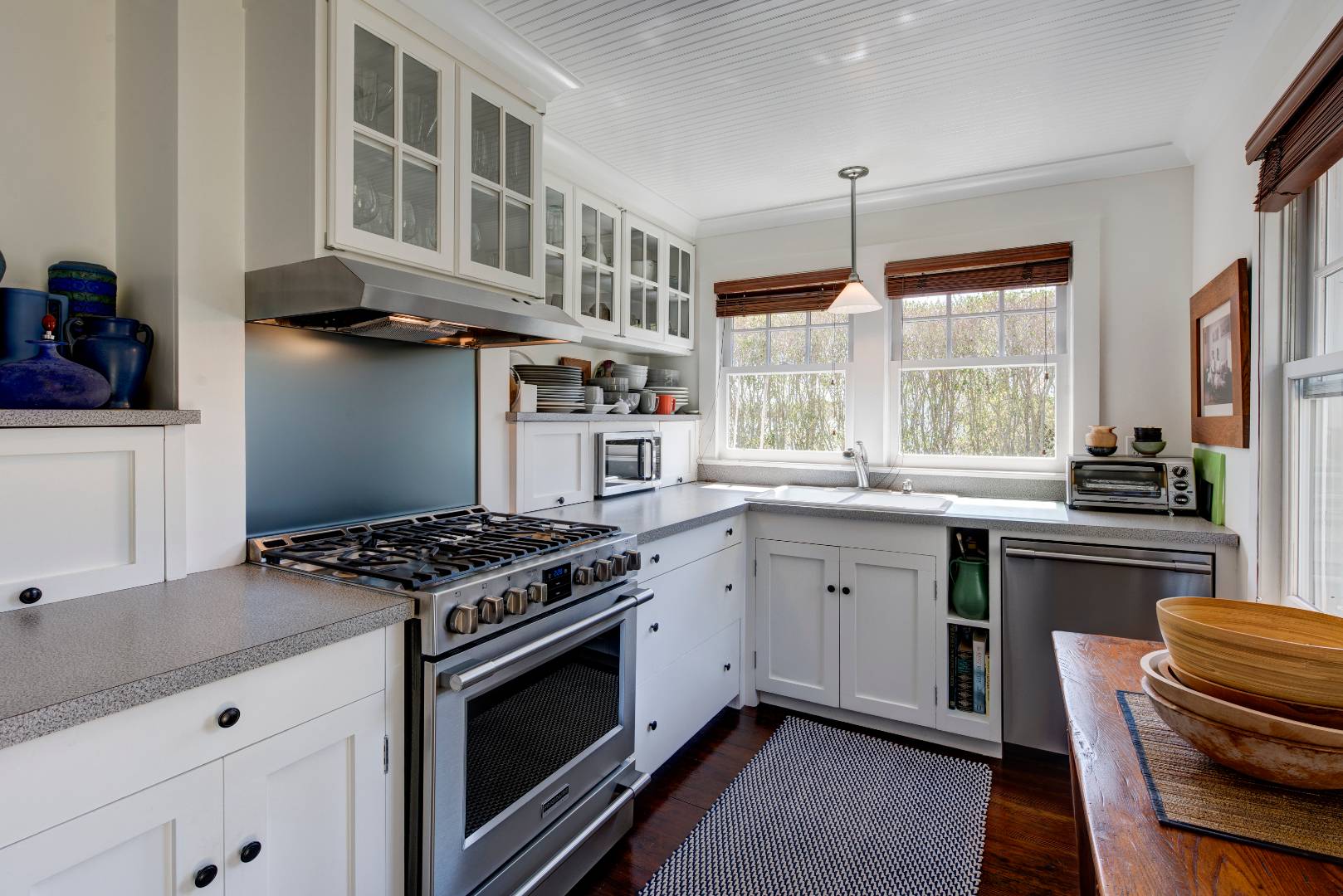 Undisclosed Address Sag Harbor, NY 11963 - Photo 10 of 16 a kitchen with stainless steel appliances granite countertop a stove a sink and a refrigerator