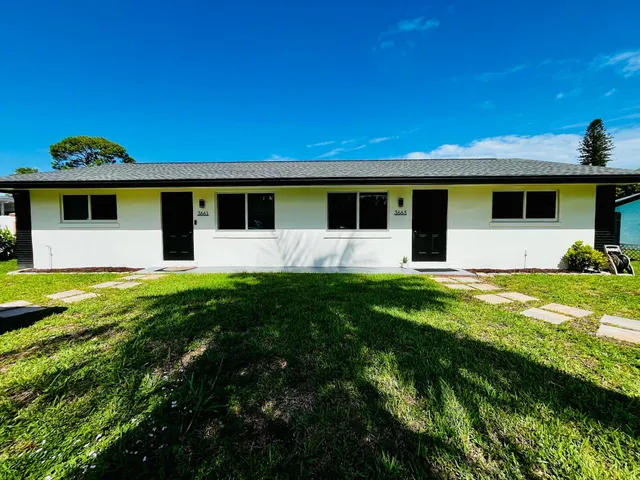 a front view of a house with yard
