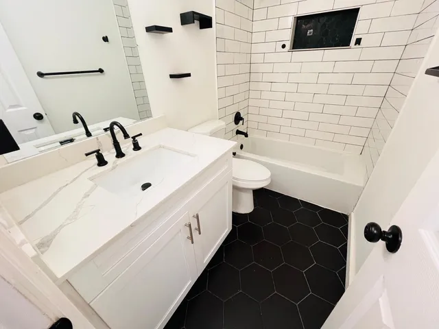 a bathroom with a sink and a bathtub