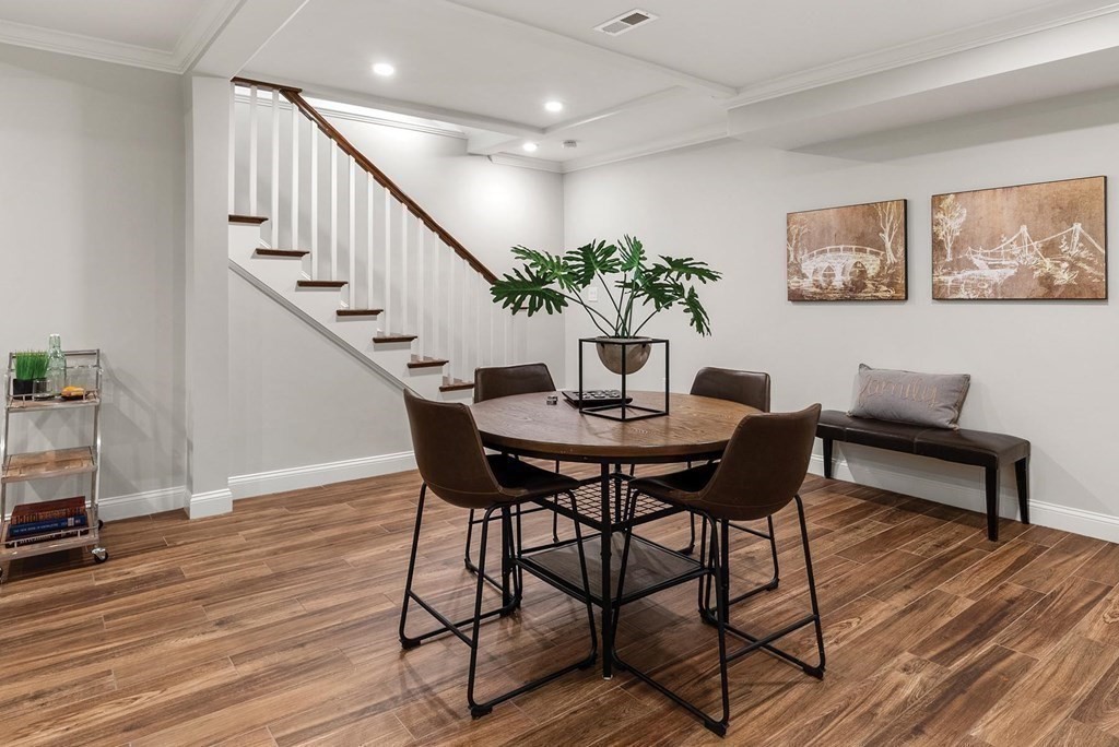 77 Beaconsfield Road, Unit 77 Brookline, MA 02445 - Photo 15 of 21 a dining room with furniture and wooden floor