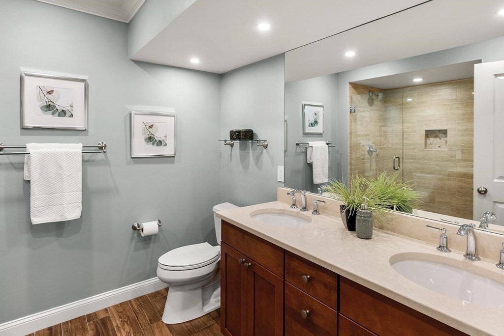 77 Beaconsfield Road, Unit 77 Brookline, MA 02445 - Photo 18 of 21 a bathroom with a toilet a sink and mirror