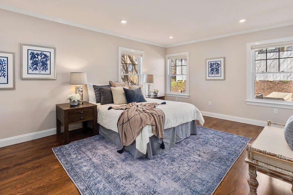 77 Beaconsfield Road, Unit 77 Brookline, MA 02445 - Photo 9 of 21 a bedroom with a bed and wooden floor