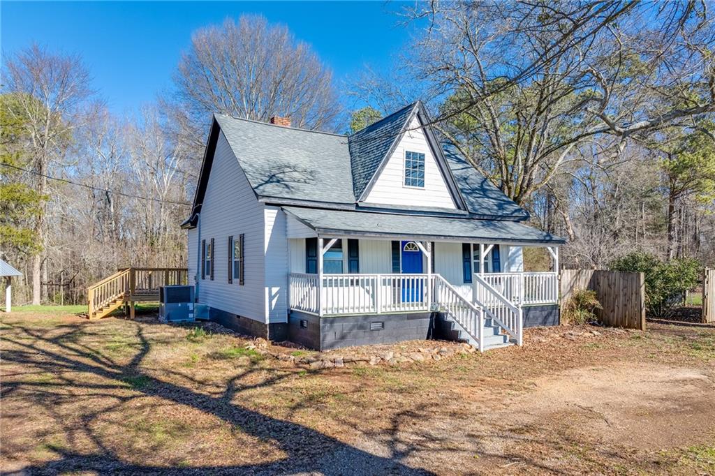 576 Loyd Nelms Road Nicholson, GA 30565 - Photo 1 of 1 a front view of a house with a yard covered with snow in front of house