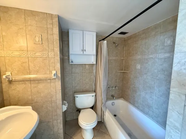 a bathroom with a toilet and shower