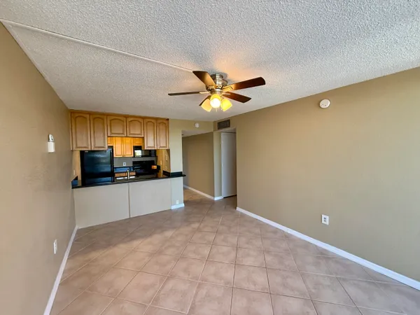 a kitchen with stainless steel appliances a white stove top oven and a refrigerator