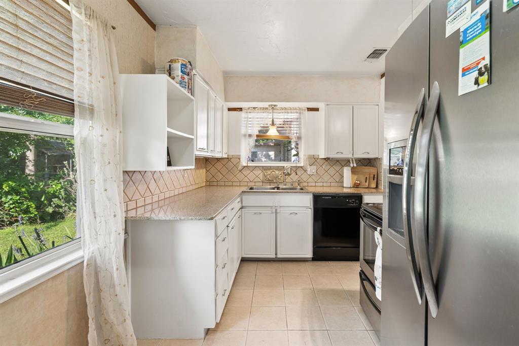 1822 Finley Road Irving, TX 75062 - Photo 17 of 38 a kitchen with a refrigerator sink and stove