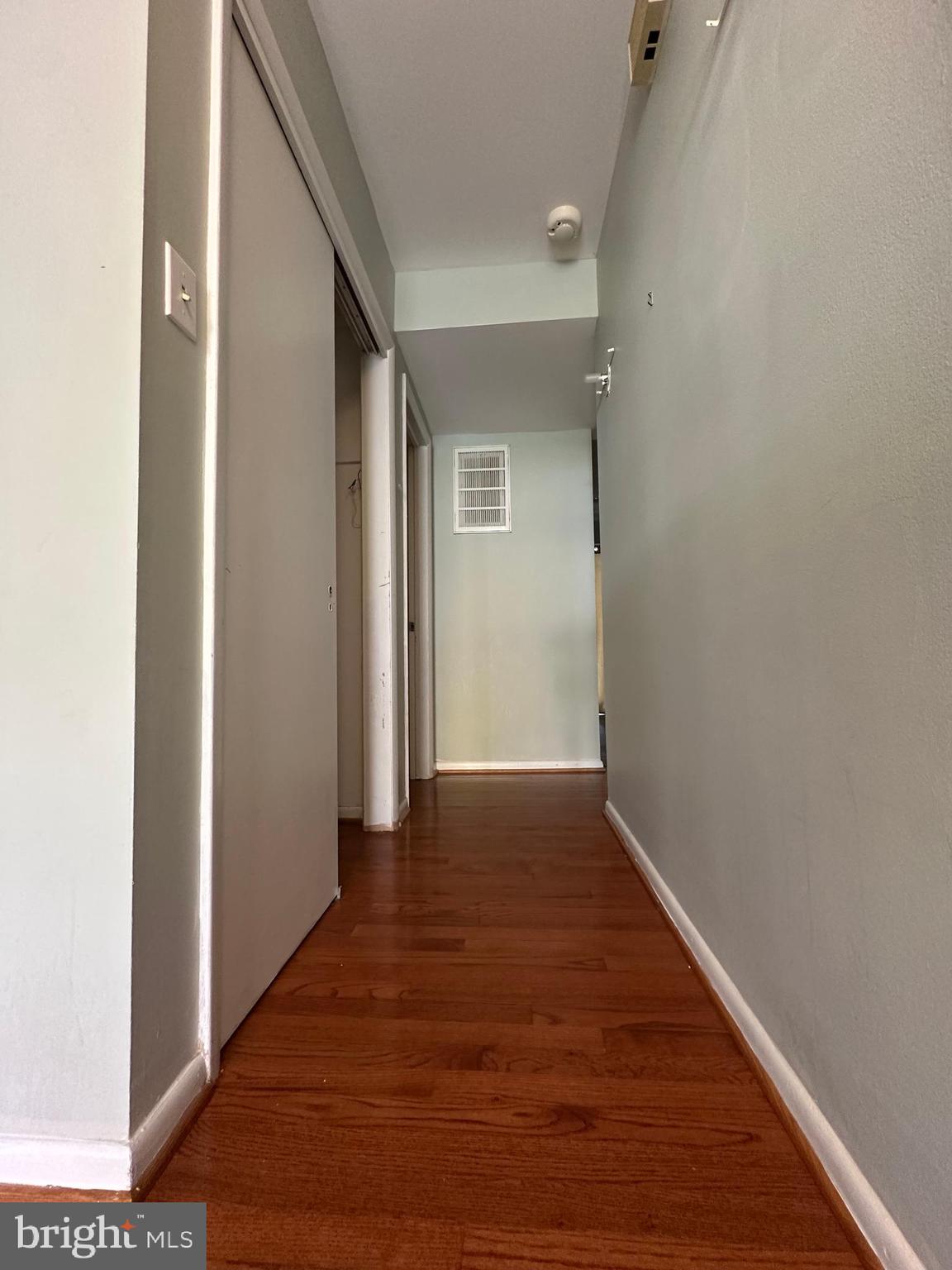 9805 Binyon Court Fort Washington, MD 20744 - Photo 13 of 25 a view of a hallway with wooden floor