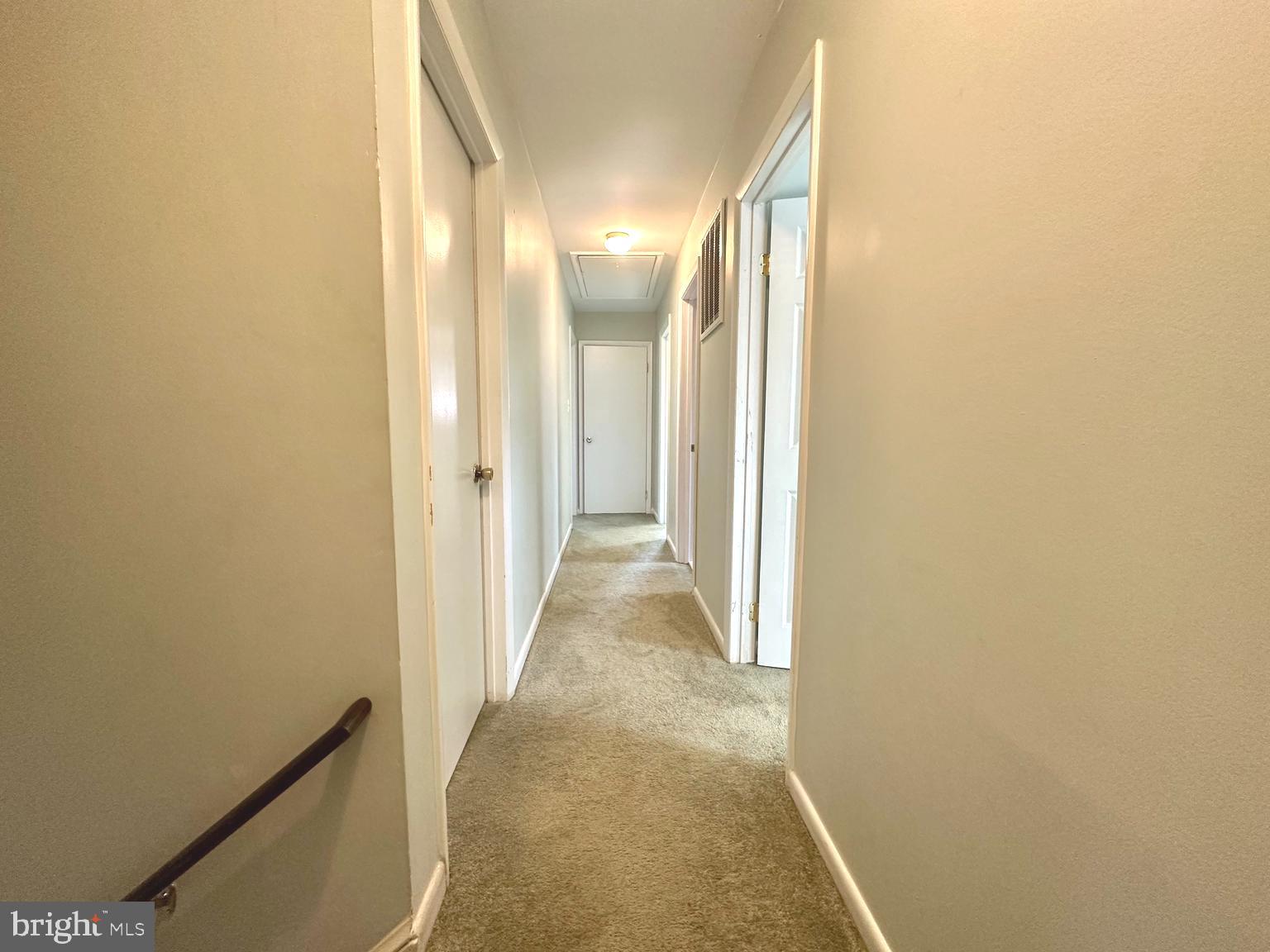 9805 Binyon Court Fort Washington, MD 20744 - Photo 19 of 25 a view of a hallway with wooden floor