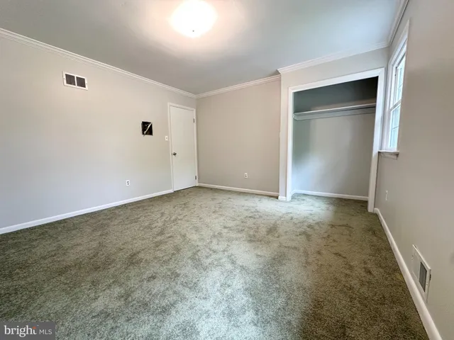a kitchen with stainless steel appliances granite countertop a stove and a microwave