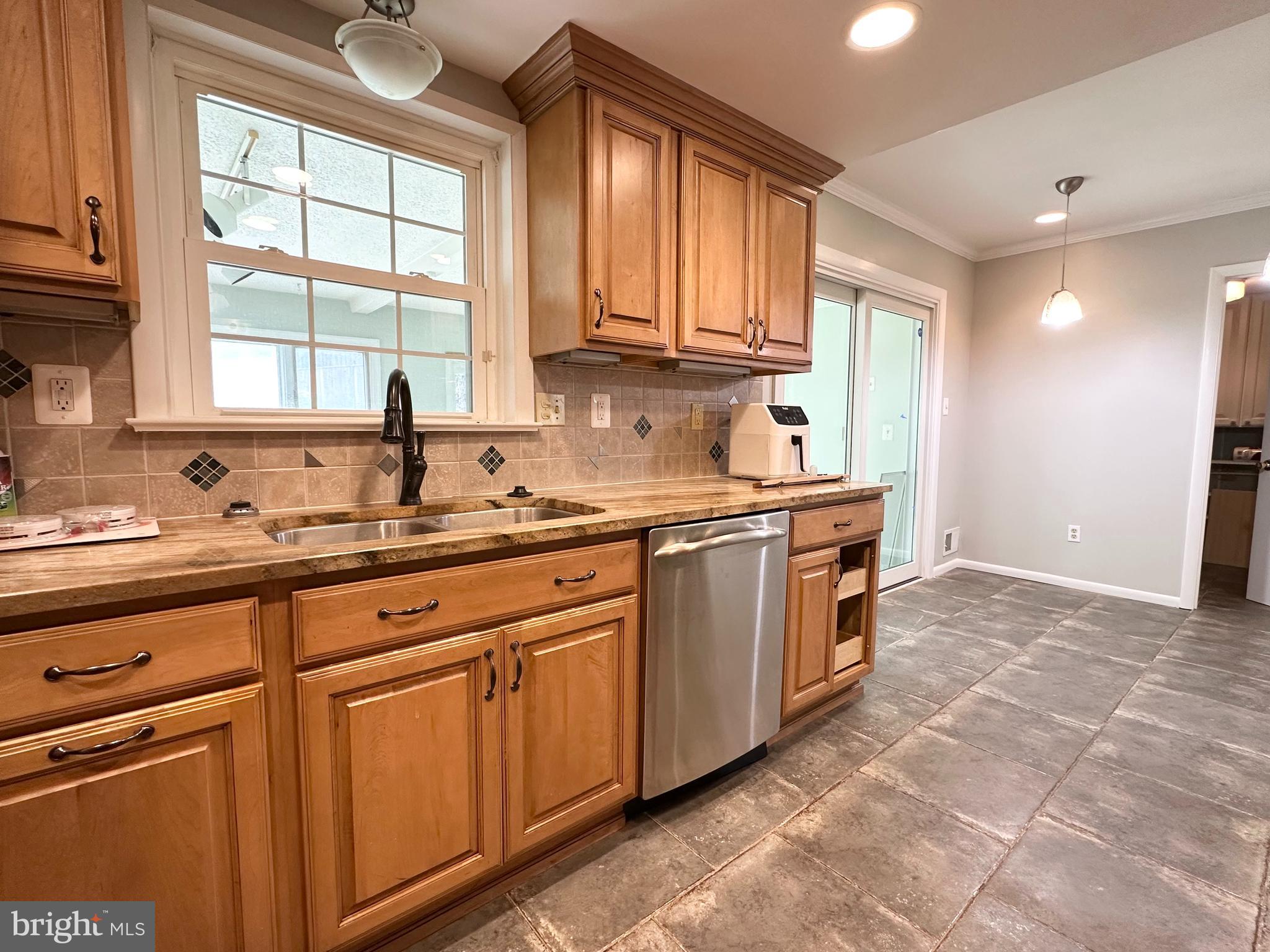 9805 Binyon Court Fort Washington, MD 20744 - Photo 9 of 25 a kitchen that has a sink and a stove in it