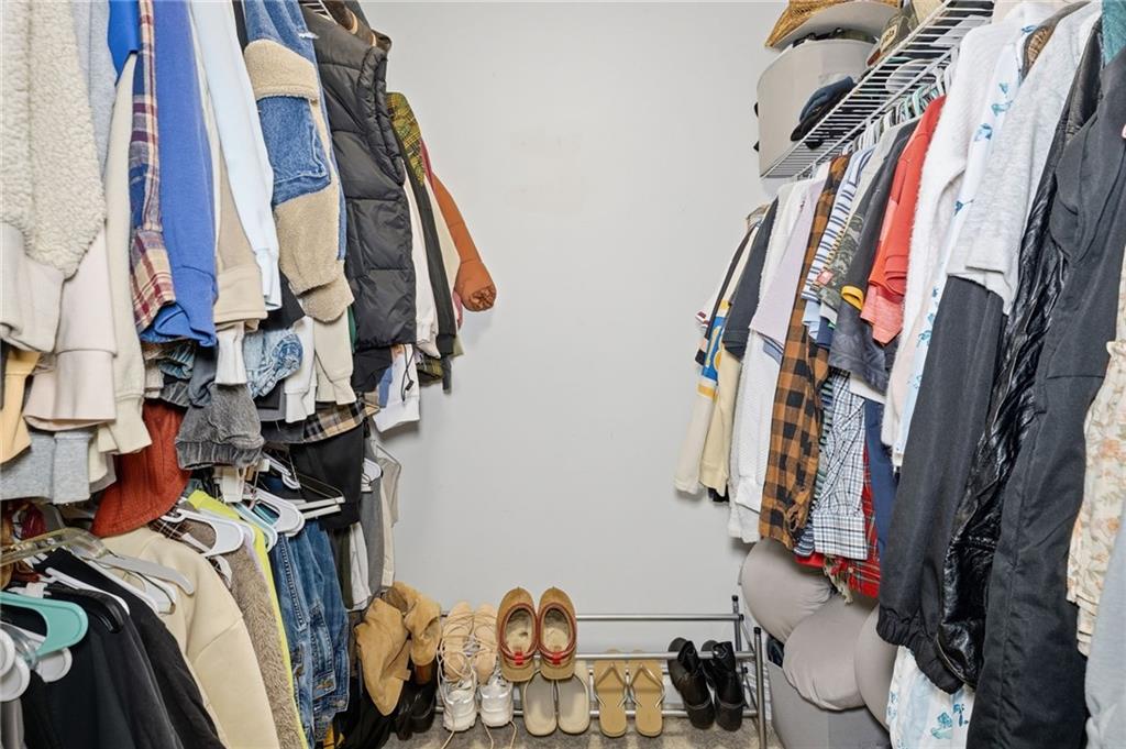 404 Brooks Street Dallas, GA 30157 - Photo 16 of 38 a view of walk in closet with clothes and shoes