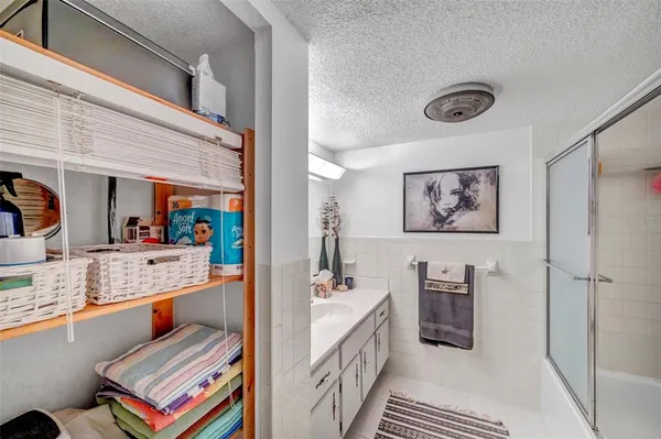 a bathroom with a sink a vanity and a mirror