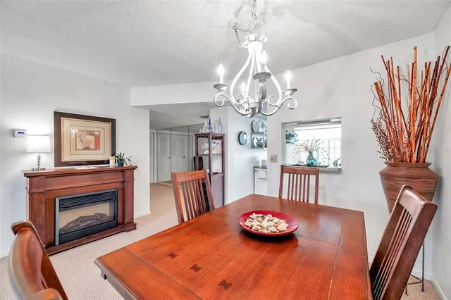 a kitchen with stainless steel appliances granite countertop a stove top oven a sink a counter space and cabinets