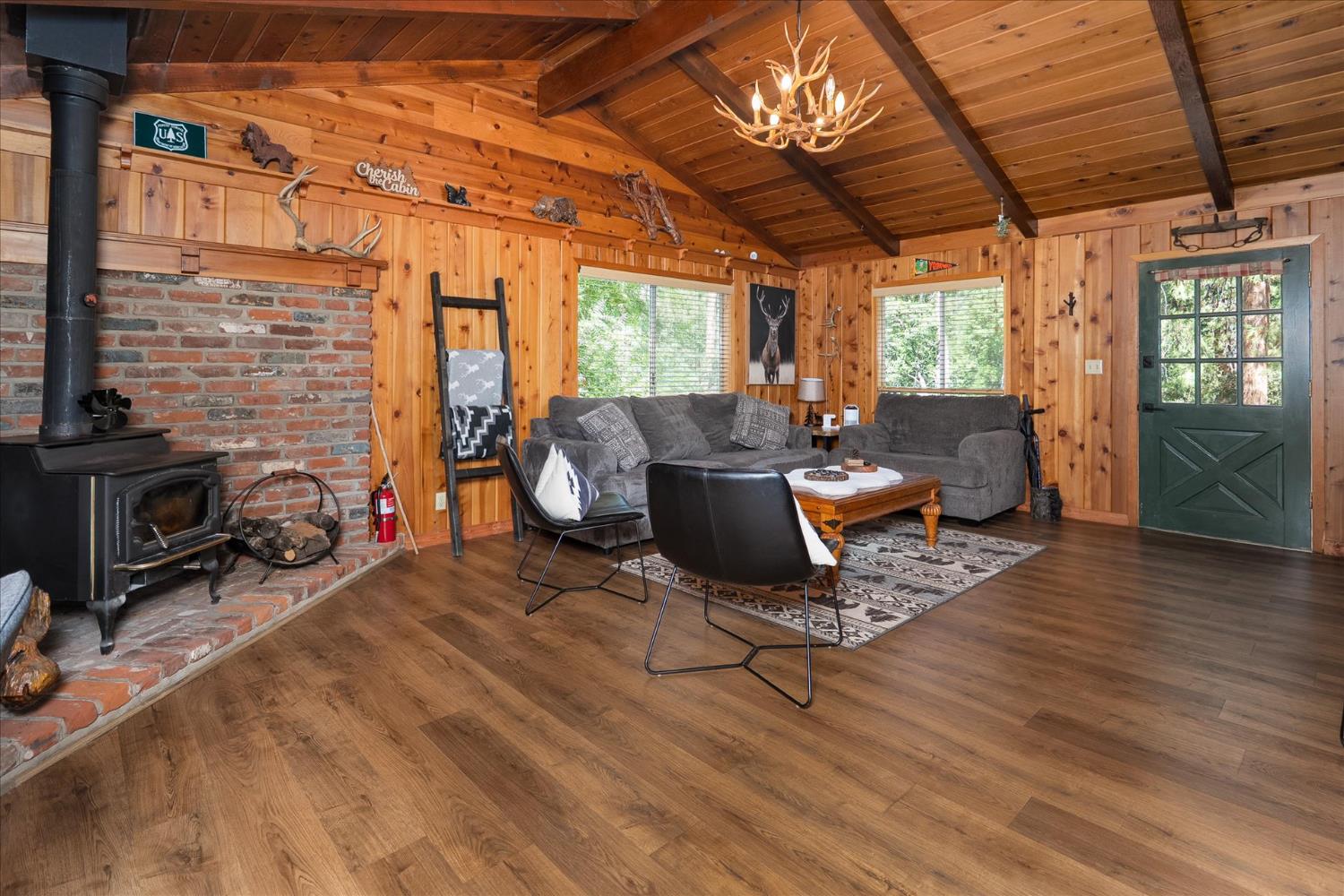 44800 Mountain Meadow Road Oakhurst, CA 93644 - Photo 19 of 41 a building outdoor space with patio furniture and wooden floor